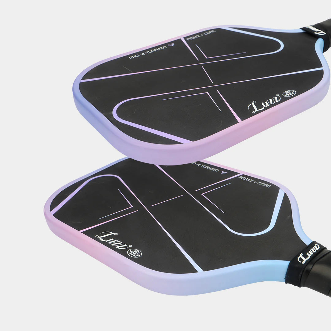 Two pickleball paddles with a gradient design on a light gray background