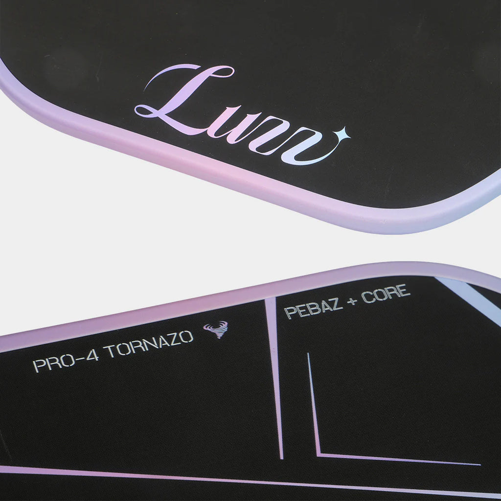 Close-up of a black and purple pickleball paddle with branding and text.