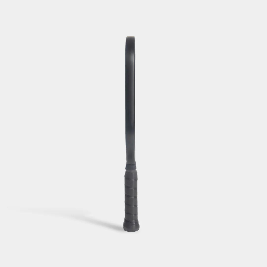 Luzz Pro Cannon pickleball paddle, side-on, all black, on a light gray background