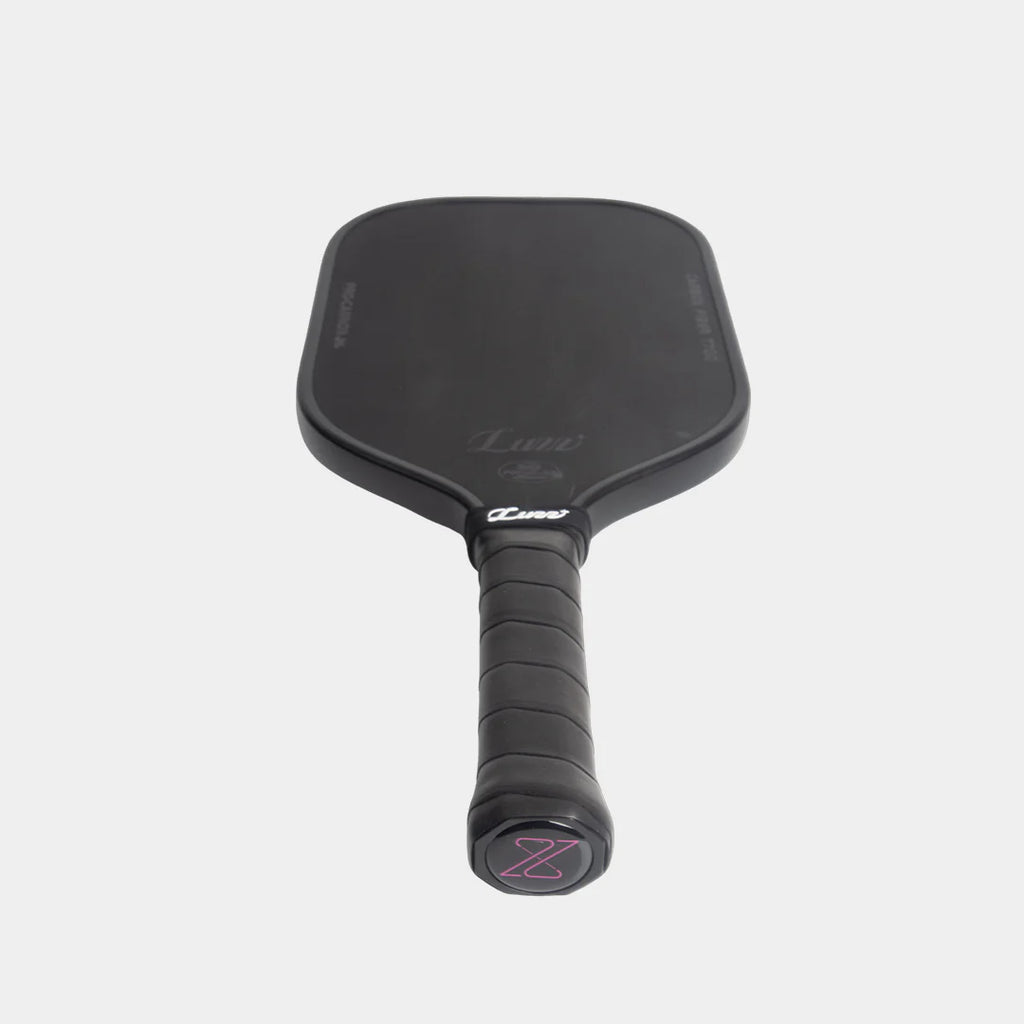 Luzz Pro Cannon pickleball paddle, all black, tilted downwards, on a light gray background
