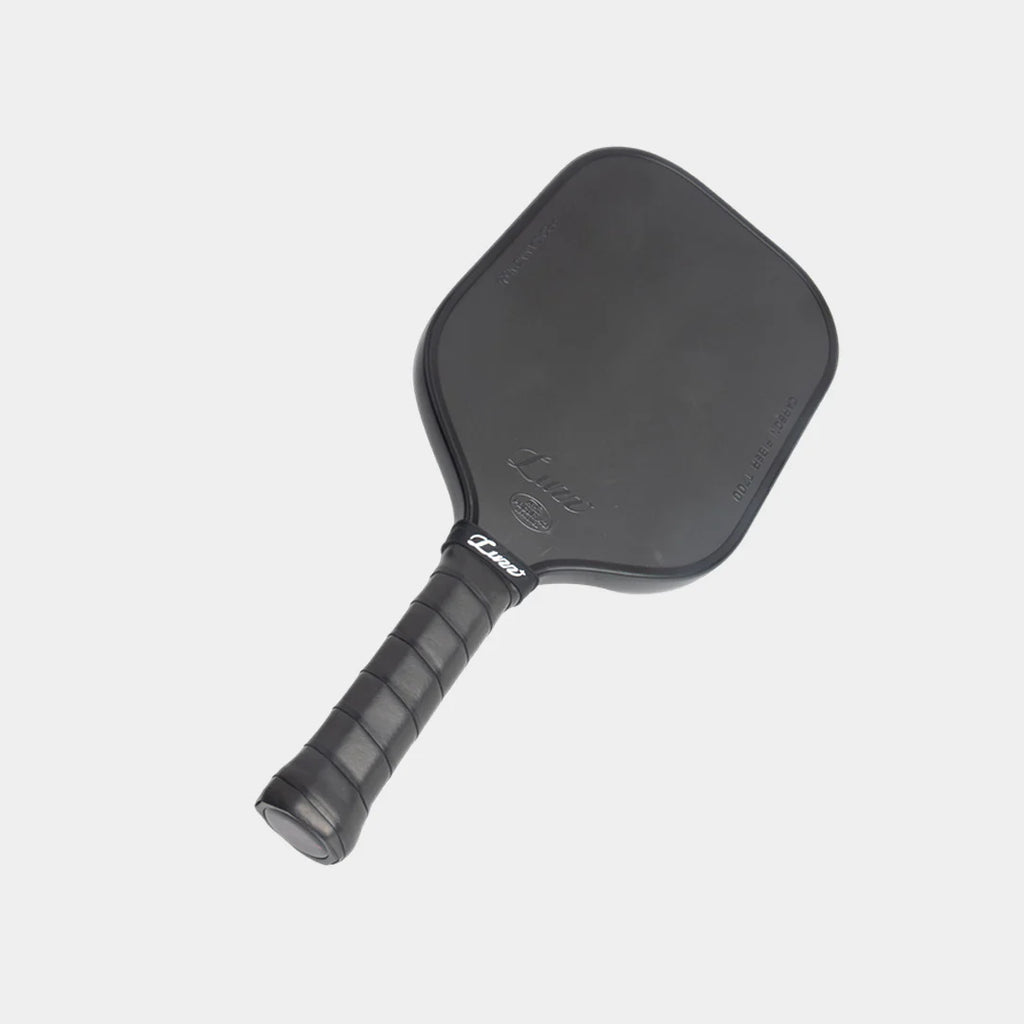 Luzz Pro Cannon all black pickleball paddle, ona slight angle to the right , on a light gray background